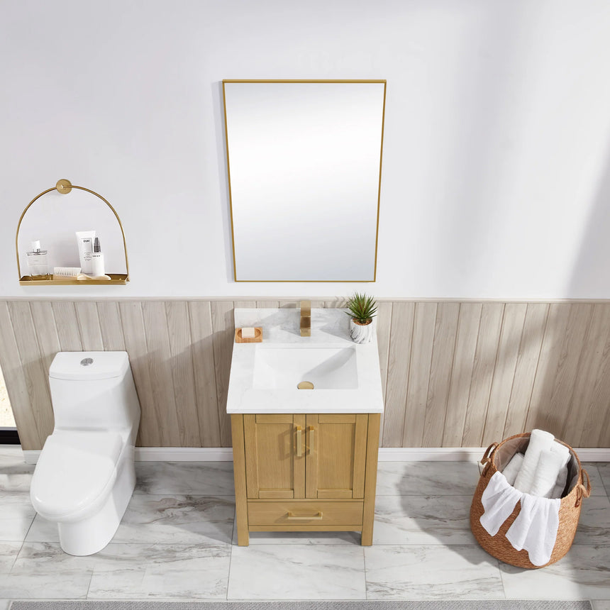 Bathroom vanity with wooden cabinets and white countertop, featuring a toilet and towel on the side.