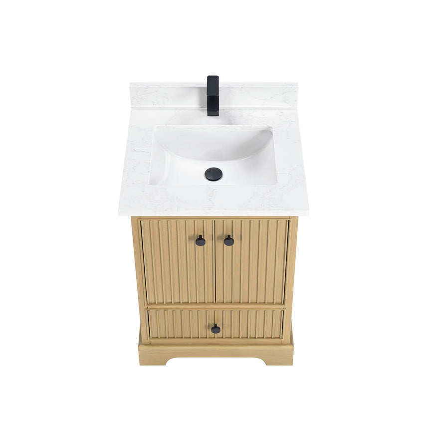 Bathroom vanity with wooden cabinet and white countertop in a bathroom setting.