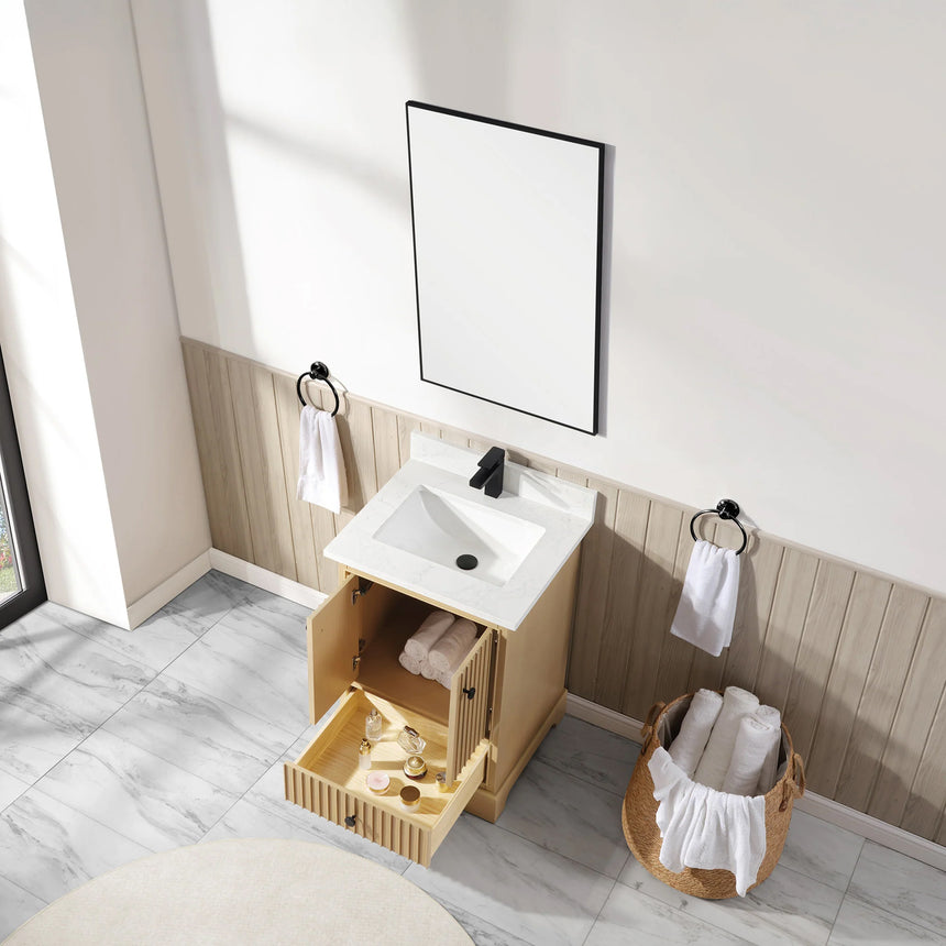 Bathroom vanity with wooden cabinet and white countertop in a bathroom setting.