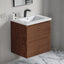 Bathroom vanity with wooden cabinet and white countertop