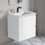 Modern bathroom vanity with sink and faucet against a neutral wall.