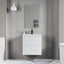 Modern bathroom with a white vanity unit, mirror, and towel radiator.