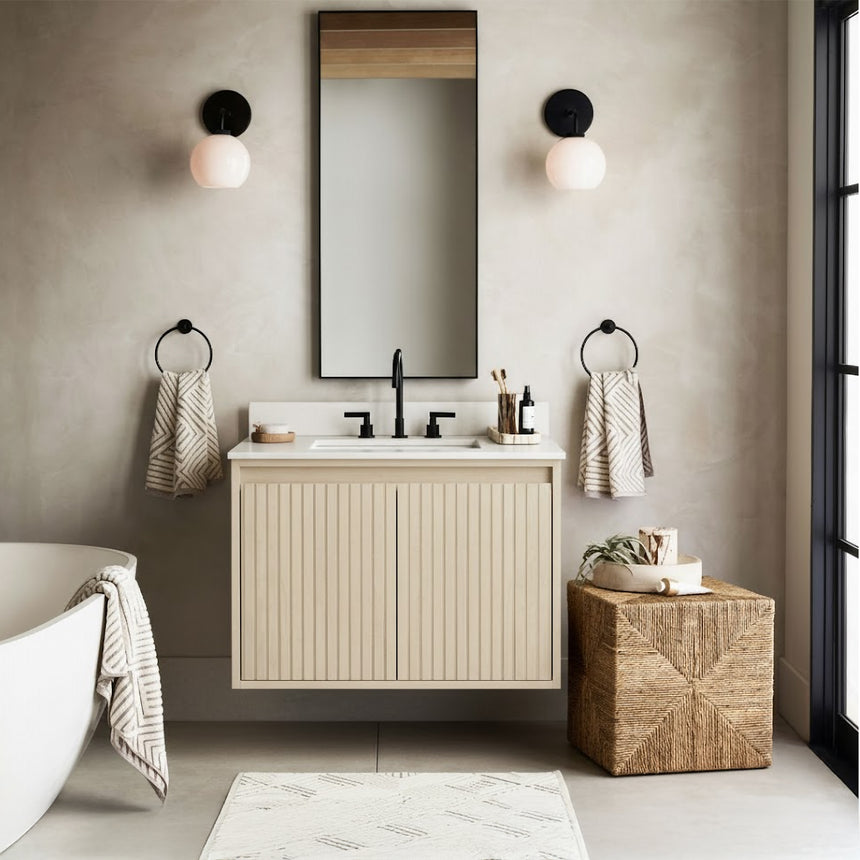 Bathroom vanity with mirror and lighting fixtures on a tiled wall.