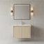 Bathroom vanity with mirror and lights on a tiled wall