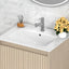 Bathroom vanity with white countertop, sink, and decorative elements.