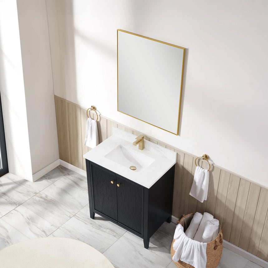 Bathroom vanity with double sink, mirrors, and towels in a well-lit room.