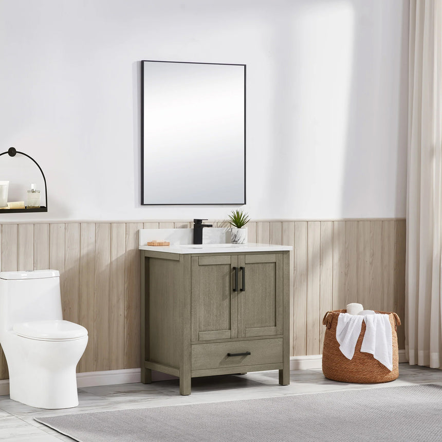 Bathroom vanity with wooden cabinets and white countertop, featuring a toilet and towel on the side.