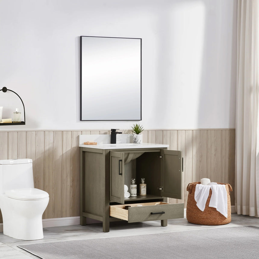 Bathroom vanity with wooden cabinets and white countertop, featuring a toilet and towel on the side.