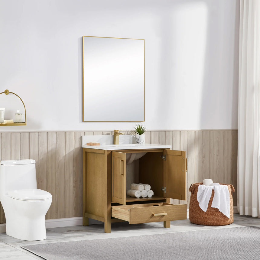 Bathroom vanity with wooden cabinets and white countertop, featuring a toilet and towel on the side.