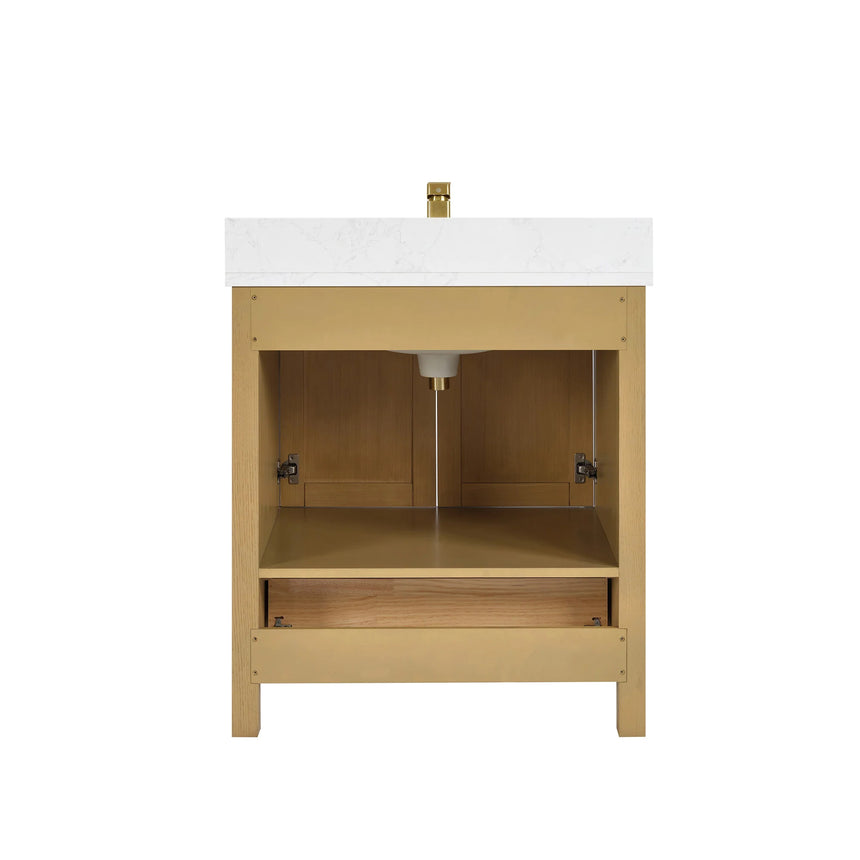 Bathroom vanity with wooden cabinets and white countertop, featuring a toilet and towel on the side.