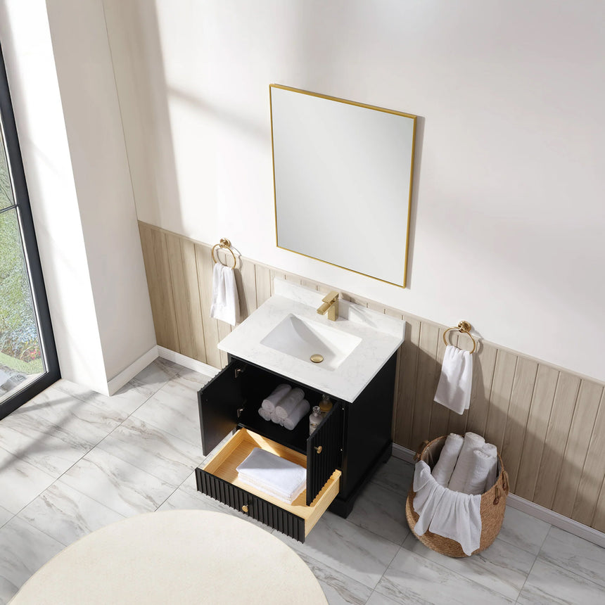 Bathroom vanity with wooden cabinet and white countertop in a bathroom setting.