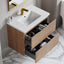 Bathroom vanity with open drawers, white sink, and gold faucet.