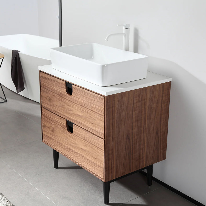 Bathroom vanity with two sinks, mirrors, and decorative elements.