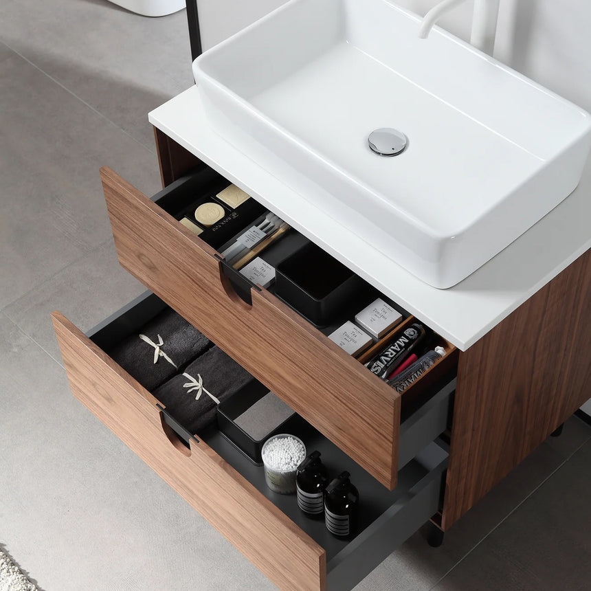 Bathroom vanity with two sinks, mirrors, and decorative elements.