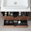Open drawer with various items underneath a white sink.