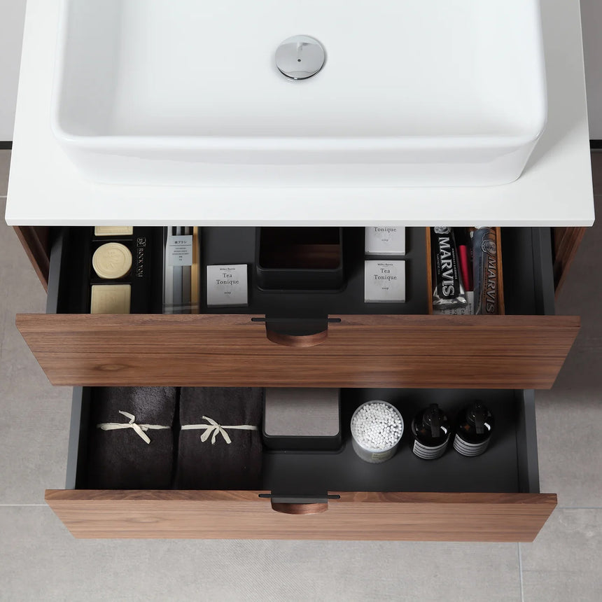 Bathroom vanity with two sinks, mirrors, and decorative elements.