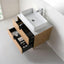 Bathroom vanity with open drawer and white sink
