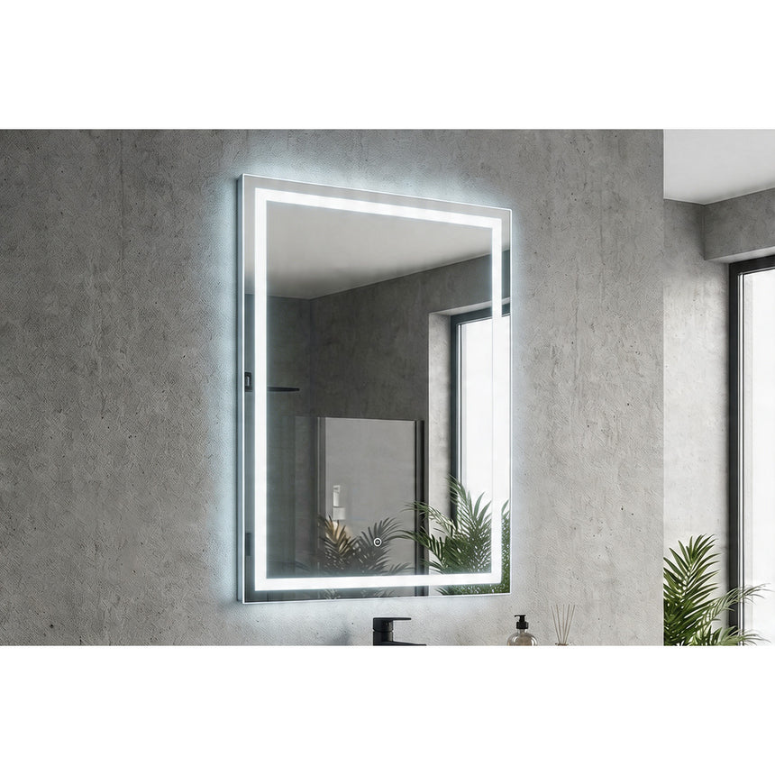 Bathroom mirror with LED lighting on a concrete wall.