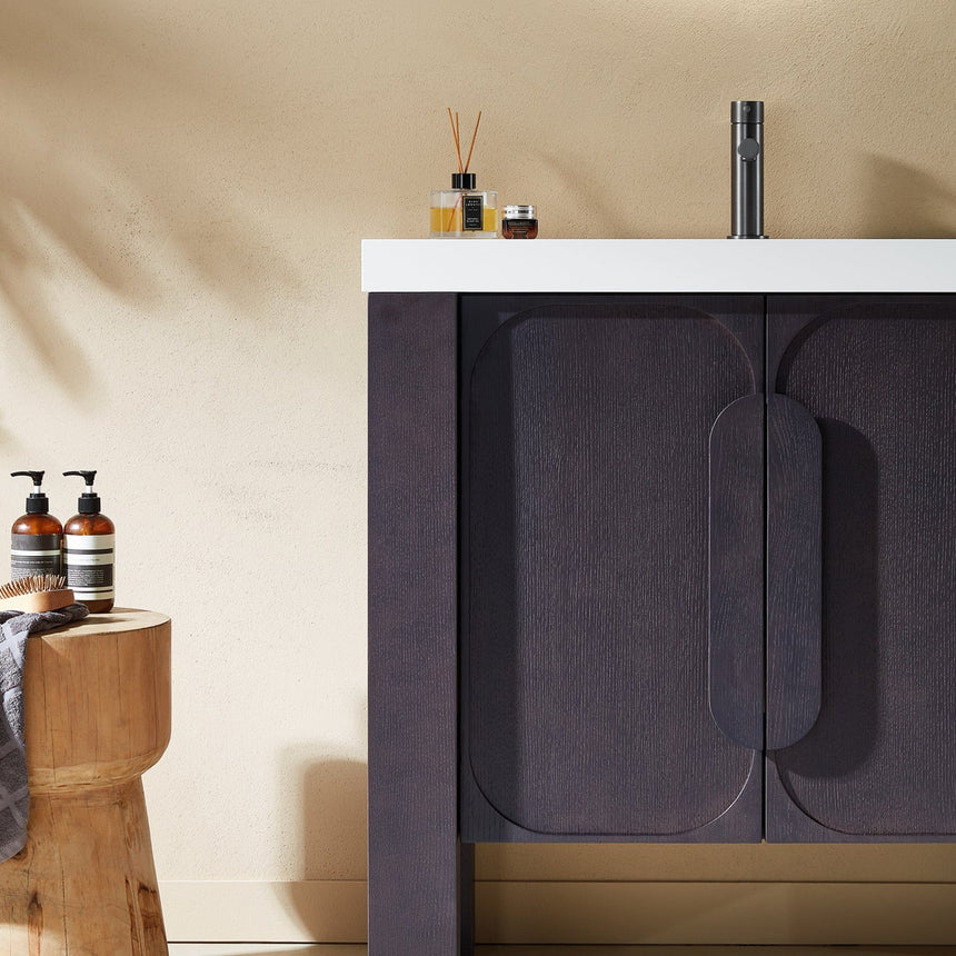 Bathroom with wooden vanity, white countertop, and decorative elements.