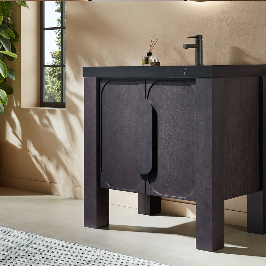 Bathroom with wooden vanity, white countertop, and decorative elements.