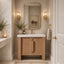 Bathroom with wooden vanity, mirror, and decorative elements