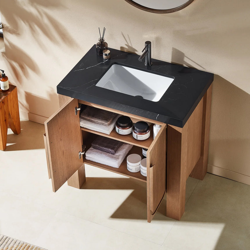 Bathroom with wooden vanity, white countertop, and decorative elements.