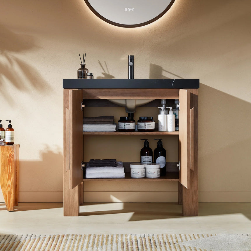 Bathroom with wooden vanity, white countertop, and decorative elements.