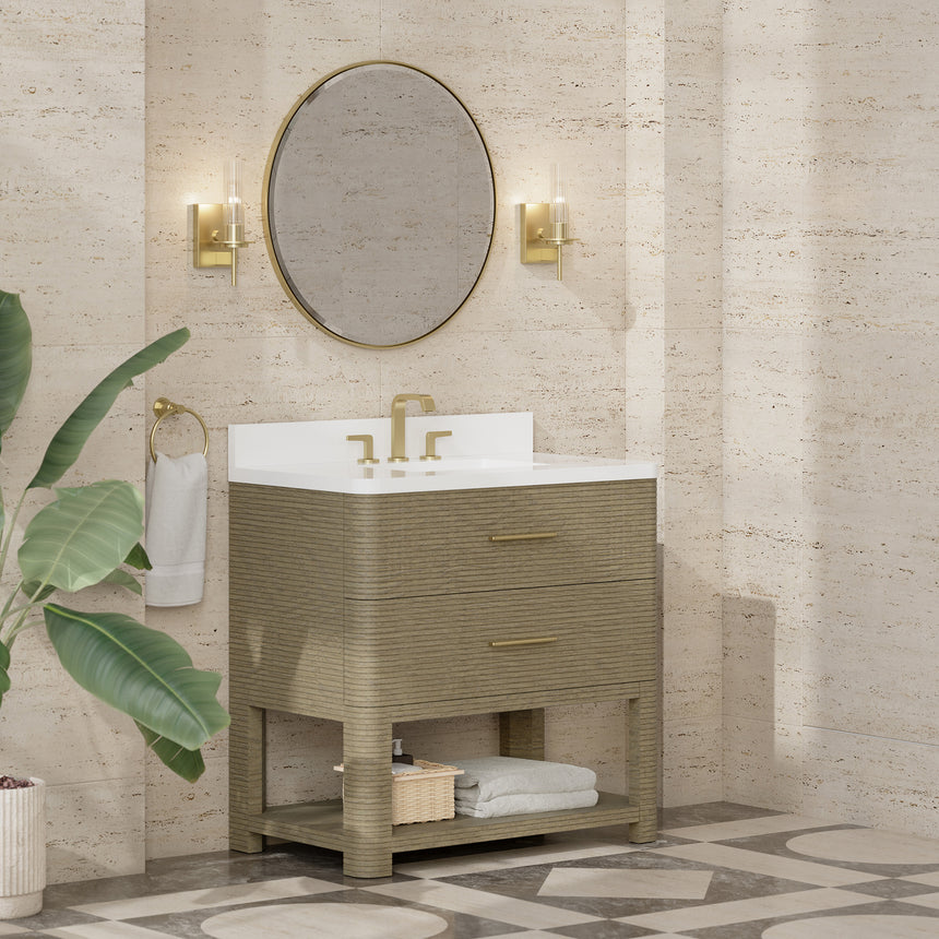 A modern bathroom vanity with a light oak wood frame, six drawers, an open lower shelf, and a white marble top with an integrated sink. The vanity is styled in a bright bathroom with a white freestanding tub, a gold faucet, and a glass shower stall in the background.