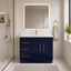 Bathroom with navy vanity, gold fixtures, and a large mirror.