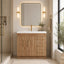 Bathroom with wooden vanity, mirror, and decorative elements