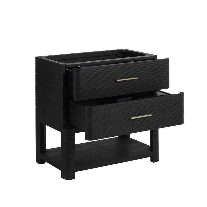 A modern bathroom vanity with a light oak wood frame, six drawers, an open lower shelf, and a white marble top with an integrated sink. The vanity is styled in a bright bathroom with a white freestanding tub, a gold faucet, and a glass shower stall in the background.