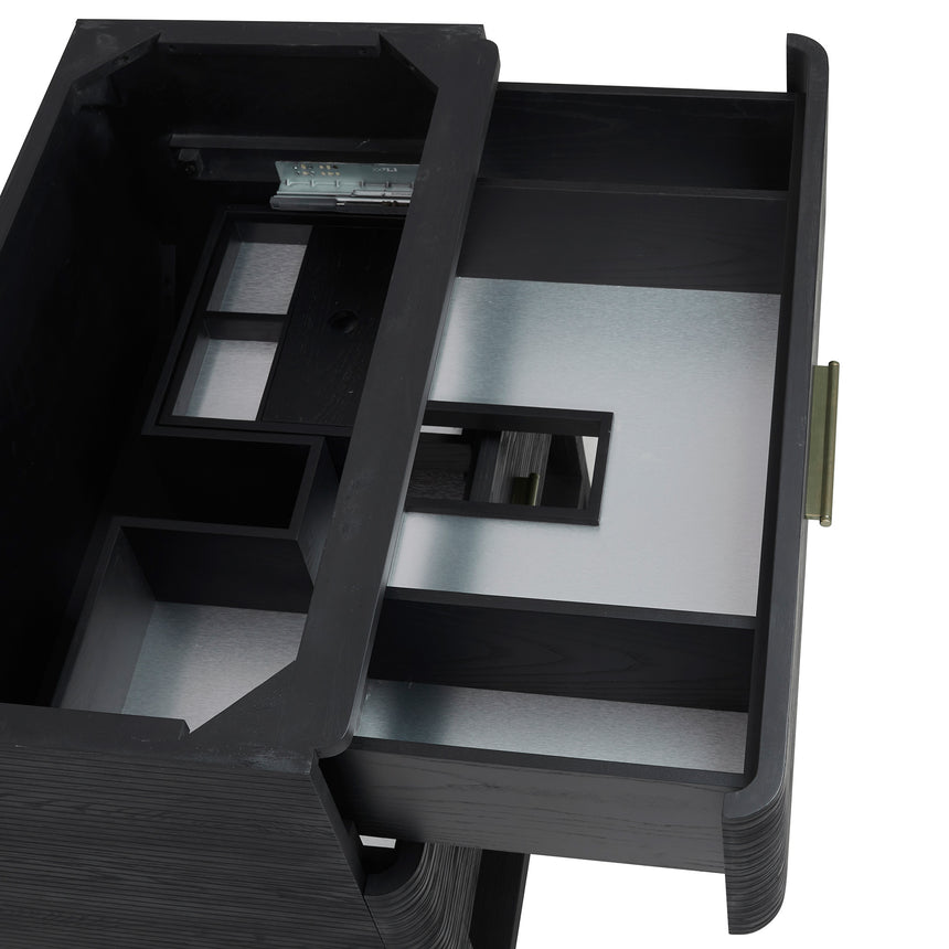 A modern bathroom vanity with a light oak wood frame, six drawers, an open lower shelf, and a white marble top with an integrated sink. The vanity is styled in a bright bathroom with a white freestanding tub, a gold faucet, and a glass shower stall in the background.