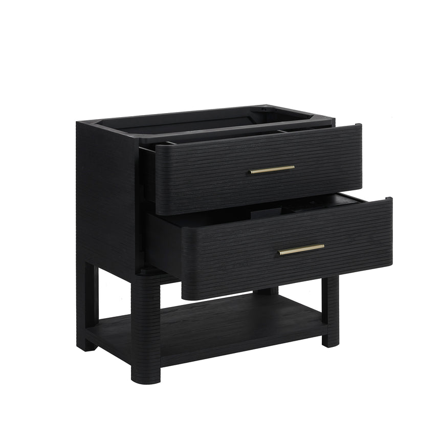 A modern bathroom vanity with a light oak wood frame, six drawers, an open lower shelf, and a white marble top with an integrated sink. The vanity is styled in a bright bathroom with a white freestanding tub, a gold faucet, and a glass shower stall in the background.