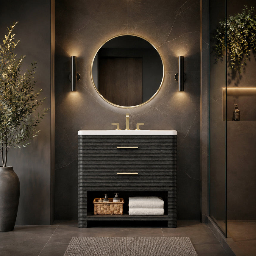A modern bathroom vanity with a light oak wood frame, six drawers, an open lower shelf, and a white marble top with an integrated sink. The vanity is styled in a bright bathroom with a white freestanding tub, a gold faucet, and a glass shower stall in the background.
