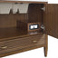 Wooden cabinet with open door revealing a outlet and storage compartments.