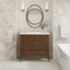 Bathroom with wooden vanity, round mirror, and decorative elements.
