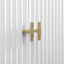 Gold handle on a white radiator