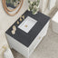 White fluted vanity with black countertop