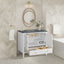 Bathroom vanity with open cabinet, round mirror, and decorative elements.