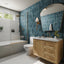 Modern bathroom with blue tiled wall, wooden vanity, and white fixtures.