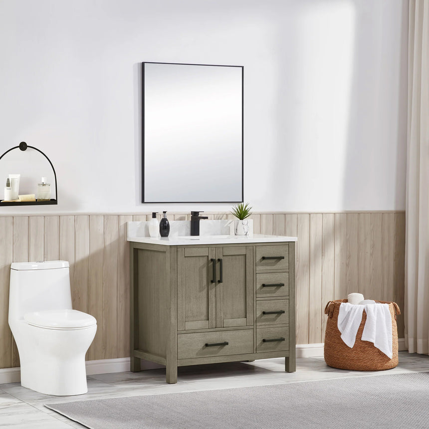 Bathroom vanity with wooden cabinets and white countertop, featuring a toilet and towel on the side.