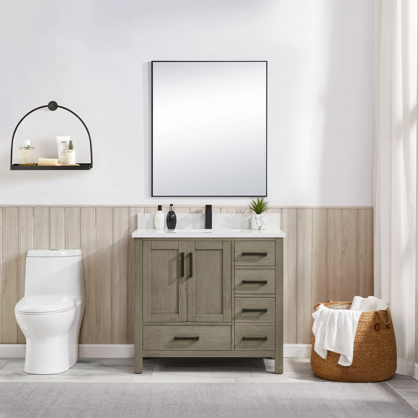 Bathroom vanity with wooden cabinets and white countertop, featuring a toilet and towel on the side.