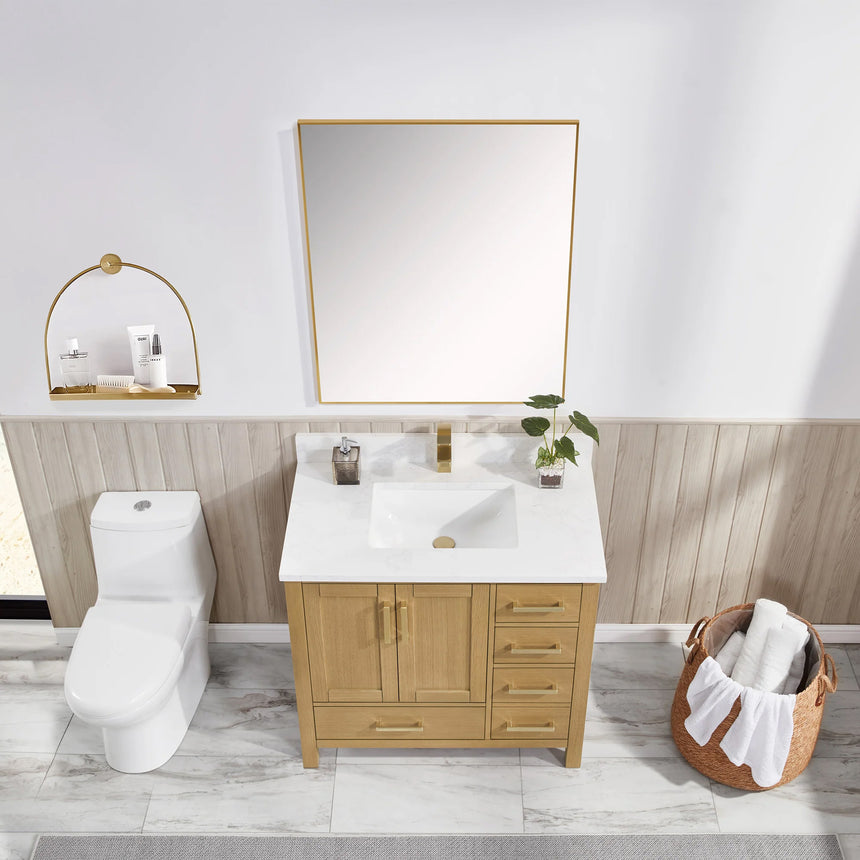 Bathroom vanity with wooden cabinets and white countertop, featuring a toilet and towel on the side.