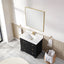 Bathroom vanity with white sink, black cabinet, and gold fixtures in a modern bathroom setting.