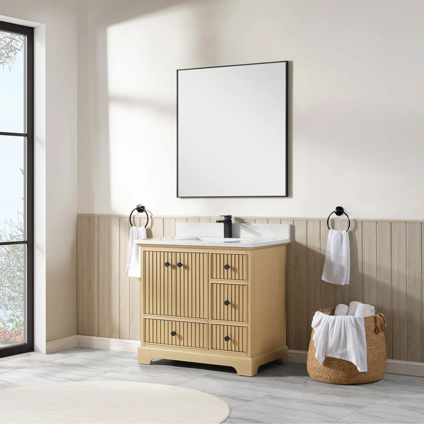 Bathroom vanity with wooden cabinet and white countertop in a bathroom setting.