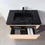 Bathroom vanity with black marble countertop and open drawer