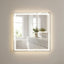 Bathroom with a large illuminated mirror reflecting a bathtub and vanity area.