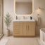 Bathroom with wooden vanity, mirror, and decorative elements