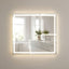 Bathroom with a large illuminated mirror reflecting a window and sink area.