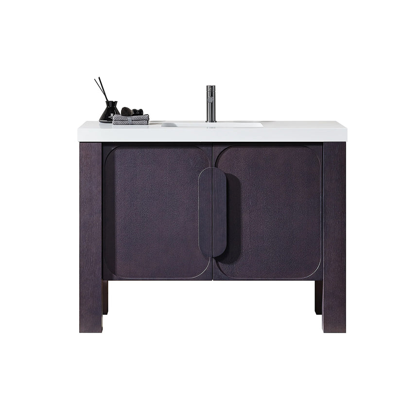 Bathroom with wooden vanity, white countertop, and decorative elements.